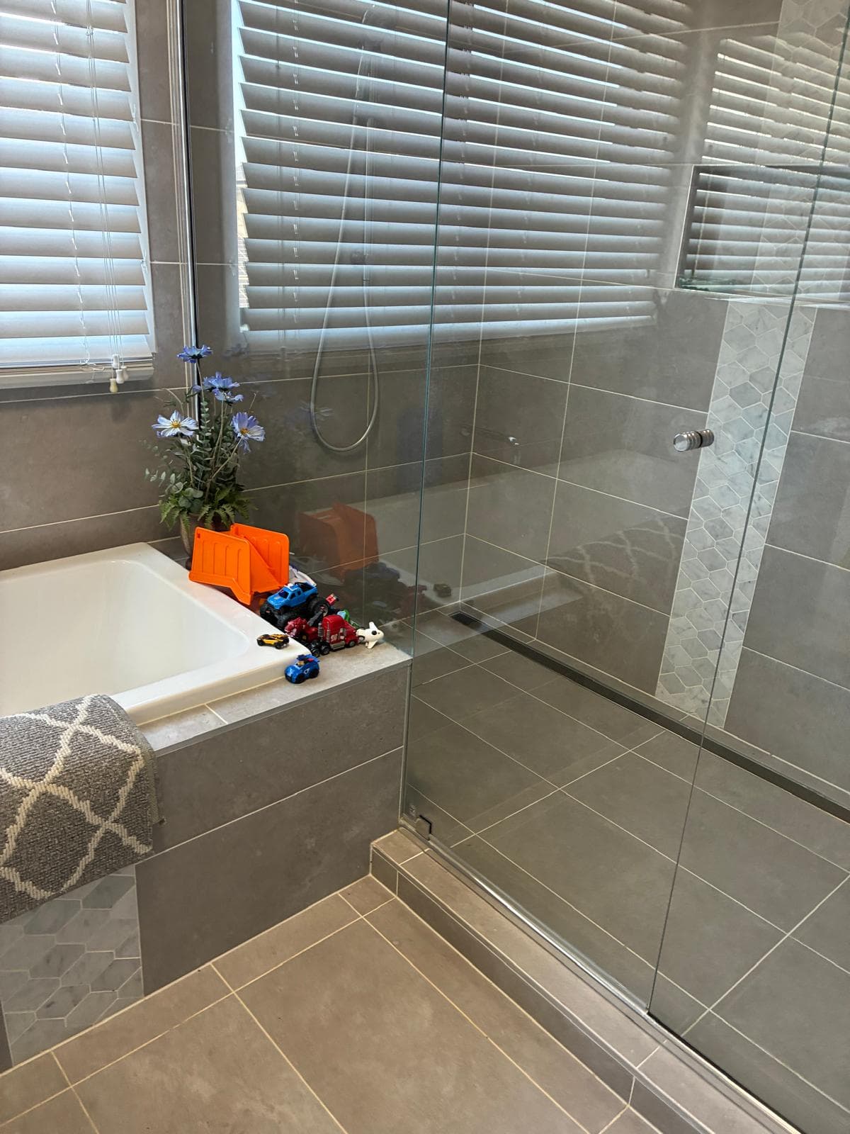 Spotless bathroom with bathtub and shower
